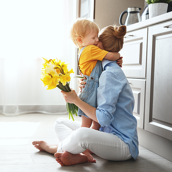 mother hugging toddler